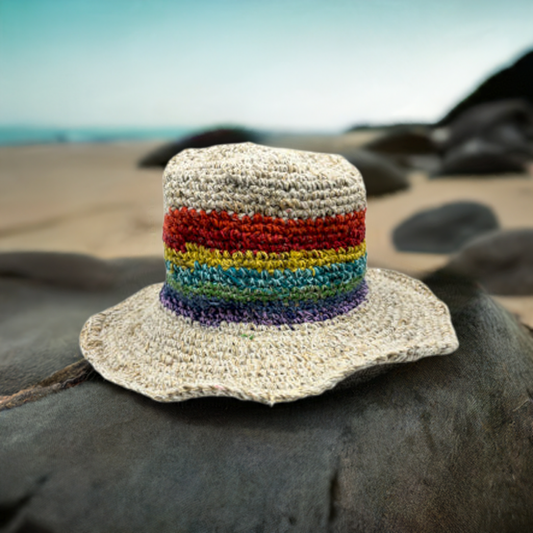 Rainbow striped hat on a beach